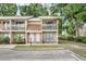 Inviting townhome with a charming exterior, featuring a cozy balcony and well-maintained landscaping at 752 Howland Ln # 114, Altamonte Springs, FL 32701