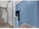 Hallway space with neutral colored carpeting and bright blue painted walls at 752 Howland Ln # 114, Altamonte Springs, FL 32701