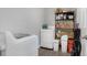 Efficient laundry room featuring modern appliances and shelving for storage at 752 Howland Ln # 114, Altamonte Springs, FL 32701
