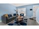 Inviting living room featuring a couch, accent chair, and geometric patterned area rug at 752 Howland Ln # 114, Altamonte Springs, FL 32701