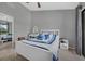 Bright bedroom featuring a ceiling fan, stylish furnishings, and ample natural light at 752 Howland Ln # 114, Altamonte Springs, FL 32701