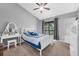 Lovely bedroom with a ceiling fan, neutral paint, a writing desk, and balcony access at 752 Howland Ln # 114, Altamonte Springs, FL 32701