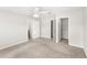 Spacious bedroom featuring carpeted floors, ceiling fan, and ample space for furniture at 7715 Anselmo Ln, Windermere, FL 34786