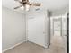 Bedroom featuring carpet, ceiling fan, and closet with double doors at 7715 Anselmo Ln, Windermere, FL 34786