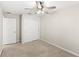 This cozy bedroom features neutral walls, carpet flooring, and a ceiling fan with overhead lighting at 7715 Anselmo Ln, Windermere, FL 34786