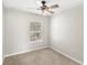 Bedroom with neutral carpet and a large window, offering a bright and welcoming atmosphere at 7715 Anselmo Ln, Windermere, FL 34786