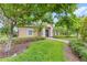Community building with manicured lawn and lush landscaping at 7715 Anselmo Ln, Windermere, FL 34786