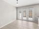 Dining area has French doors leading to an enclosed private courtyard, with ceramic tile at 7715 Anselmo Ln, Windermere, FL 34786