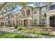 Charming townhomes with landscaped front yards and inviting front porches at 7715 Anselmo Ln, Windermere, FL 34786