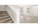 Well-lit foyer boasts a staircase leading to the second floor and views of a spacious living area at 7715 Anselmo Ln, Windermere, FL 34786