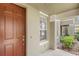 Inviting entrance with a wood front door and sidelight window at 7715 Anselmo Ln, Windermere, FL 34786