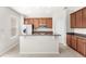 Bright kitchen features stainless steel appliances, granite countertops and center island with bar seating at 7715 Anselmo Ln, Windermere, FL 34786