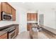 This kitchen features stainless steel appliances and granite countertops with a double sink and sleek range at 7715 Anselmo Ln, Windermere, FL 34786