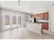Bright kitchen has stainless appliances, granite counters, a breakfast bar, and dining area with courtyard access at 7715 Anselmo Ln, Windermere, FL 34786