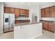 Bright kitchen features stainless steel appliances, granite countertops and center island with bar seating at 7715 Anselmo Ln, Windermere, FL 34786