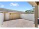 Private brick patio enclosed by a white fence and attached to the house at 7715 Anselmo Ln, Windermere, FL 34786