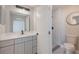 Modern bathroom features sleek vanity, black fixtures, and tiled walk-in shower at 8141 Golden Chickasaw Cir, Orlando, FL 32825