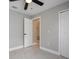 Bedroom with an open door leading to bathroom and a closet at 8141 Golden Chickasaw Cir, Orlando, FL 32825