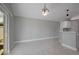 Dining room with sliding glass doors, tile floors and updated light fixture at 8141 Golden Chickasaw Cir, Orlando, FL 32825