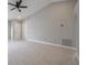 Living room featuring white tile flooring, ceiling fan, and vaulted ceiling at 8141 Golden Chickasaw Cir, Orlando, FL 32825