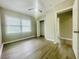 Spacious bedroom with ample natural light from a large window and a convenient closet for storage at 820 Maley St, Daytona Beach, FL 32114