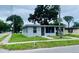 Quaint corner-lot home, featuring a covered carport and screened-in porch at 820 Maley St, Daytona Beach, FL 32114