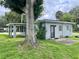 View of a small house highlighting a covered carport and simple design at 820 Maley St, Daytona Beach, FL 32114