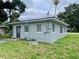 Corner view of the property featuring a covered carport and screened porch on the house at 820 Maley St, Daytona Beach, FL 32114