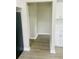 View of hallway between kitchen and room features updated flooring at 820 Maley St, Daytona Beach, FL 32114