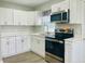 Updated kitchen featuring sleek cabinets, countertops, and stainless steel appliances at 820 Maley St, Daytona Beach, FL 32114