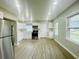 Bright kitchen featuring stainless steel appliances, white cabinets, and modern countertops at 820 Maley St, Daytona Beach, FL 32114