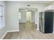View of living room from kitchen showcases an open layout with modern flooring at 820 Maley St, Daytona Beach, FL 32114