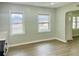 Bright living room with large windows and modern flooring, perfect for relaxing at 820 Maley St, Daytona Beach, FL 32114