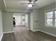 Open-concept living room features modern flooring, ceiling fan, and natural light at 820 Maley St, Daytona Beach, FL 32114