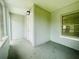 Enclosed porch featuring a light fixture and an adjacent interior door at 820 Maley St, Daytona Beach, FL 32114