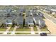 Aerial view of a community of modern homes with well-maintained landscaping and gray roofs at 8964 Takeaway Way, Davenport, FL 33896