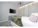 Cozy bedroom with modern furnishings, soft lighting, and a relaxing ambiance at 8964 Takeaway Way, Davenport, FL 33896
