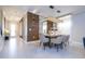 Bright dining room featuring modern lighting, stylish decor, and tile flooring at 8964 Takeaway Way, Davenport, FL 33896