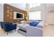 Spacious living room with a comfortable sectional sofa, stylish decor, and lots of natural light at 8964 Takeaway Way, Davenport, FL 33896