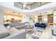 Open floor plan with living, dining and kitchen area in a modern home interior at 8964 Takeaway Way, Davenport, FL 33896