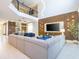 Open-concept living area showcasing modern design, stylish furnishings, and lots of natural light at 8964 Takeaway Way, Davenport, FL 33896