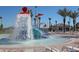 View of the splash pad and water park with lounge chairs at 8964 Takeaway Way, Davenport, FL 33896