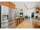 Modern kitchen features stainless steel appliances, granite countertops, wine cooler, and seamless access to living areas at 898 Shed St, Oviedo, FL 32765