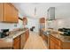 Bright kitchen showcases granite countertops, stainless appliances, custom cabinetry, and a functional layout at 898 Shed St, Oviedo, FL 32765
