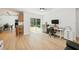 Bright space with backyard views offers a modern desk, and blends seamlessly with the adjacent kitchen and dining areas at 898 Shed St, Oviedo, FL 32765