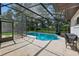 Relax by the crystal-clear pool inside a screened enclosure, surrounded by a spacious patio and a well-fenced backyard at 898 Shed St, Oviedo, FL 32765