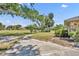 Backyard featuring trees, an open grassy area, and a concrete patio at 1115 Lake Francis Dr, Apopka, FL 32712