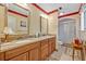 Bathroom featuring a double sink vanity, granite countertops, and a glass-enclosed shower stall at 1115 Lake Francis Dr, Apopka, FL 32712