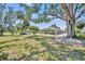 Exterior view of a home in a spacious backyard setting at 1115 Lake Francis Dr, Apopka, FL 32712
