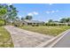 Charming single-story home with stone accents, mature trees, and walkway leading to the front entrance at 1115 Lake Francis Dr, Apopka, FL 32712